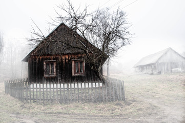 Wooden hut in a fog