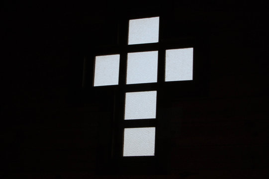 Stained glass in the shape of a cross