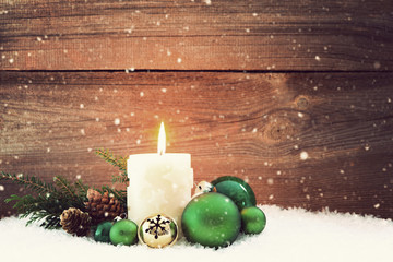 candle in snow christmas background