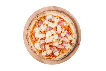 Pizza with with bacon, ham and cheese lies on a round wooden board isolated on a white background.