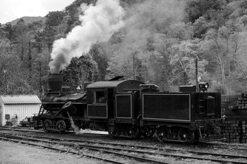 Old steam locomotive building steam getting ready for a trip down the tracks
