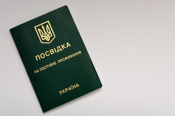 Residence permit in Ukraine on the white table. 