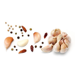 Raw garlic segments and peppers.