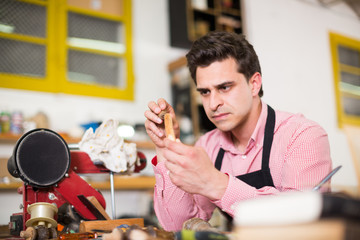 Craftsman in uniform working in carpentry