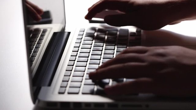 close-up view of a man hands working on Laptop 