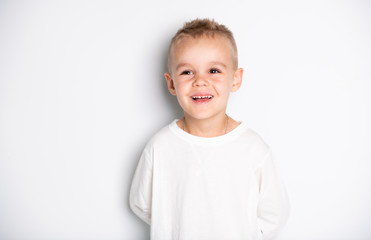 Fototapeta premium Close up portrait of cute little boy on background