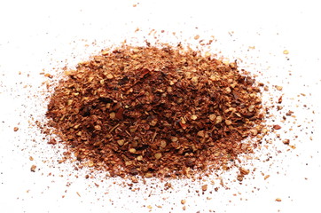 pile dry crushed red pepper, dried chili flakes and seeds isolated on white background