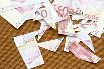small pieces five hundred euros on a fabric background rope