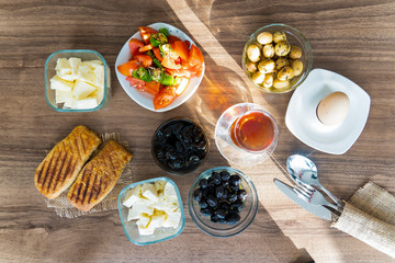 Breakfast with tea on wooden table