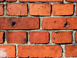 WW2 red brick wall background with bullet holes