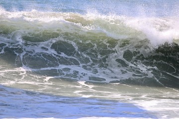 large empty wave crashing in the ocean 