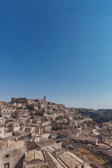 Fototapeta na wymiar The sassi of Matera, Italy under blue sky