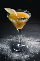 yellow christmas alcohol pear cocktail pear on dark background