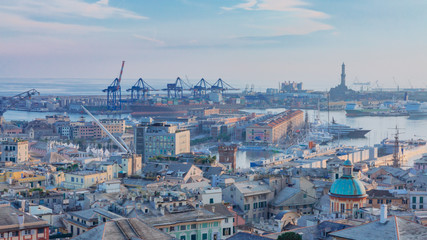 Historical center and the port of Genoa at dusk in Genoa, Italy