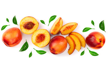 ripe nectarine with leaves isolated on white background with copy space for your text. Top view. Flat lay pattern