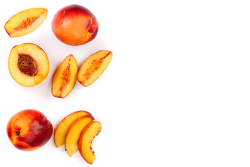 ripe nectarine with leaves isolated on white background with copy space for your text. Top view. Flat lay pattern