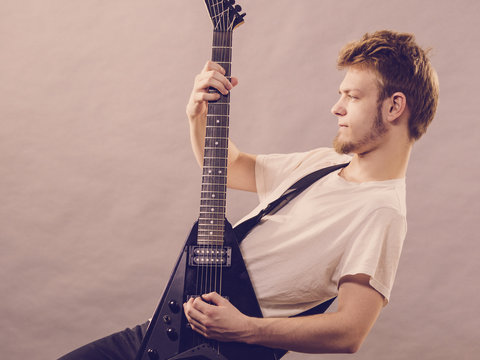 Man playing on electric guitar