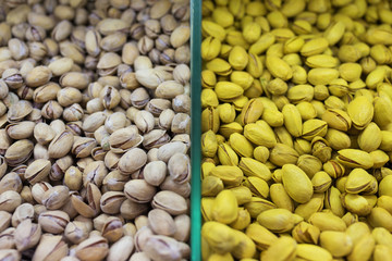 Pistachios on store counter background