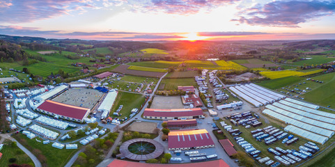 Aerial drone view of a horse riding competition in Hagen Osnabrück at Sunset
