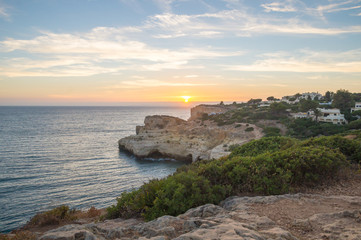Fototapeta na wymiar Summer sunset by Algar Seco on the Algarve, Portugal.