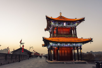 Fototapeta premium Beautiful illuminated chinese temple by night in Xi'An, China