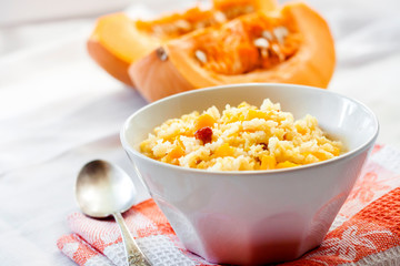 Milky cereal porridge with pumpkin and raisins