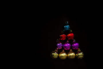 Color christmas balls on dark background