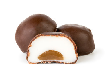Chocolates with white filling on a white background.