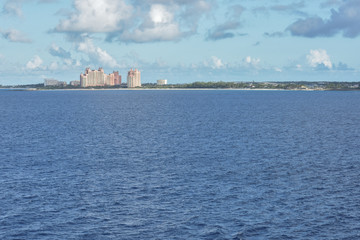 wide shot of beautiful vacation resort buildings at sea on a clear sunny morning 