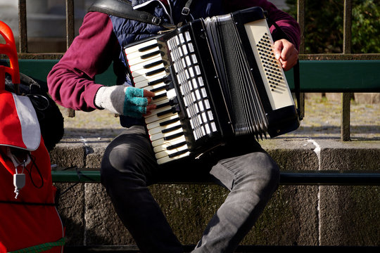 Street musicians perform for tourists and tips