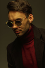 Fototapeta premium Portrait of a stylish man in sunglasses. Creative color