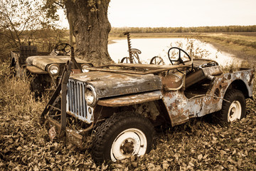 rusting willis jeep in the country side - obrazy, fototapety, plakaty