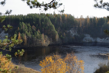 Picturesque autumn forest and pond of the Karelian village Girvas, Russia
