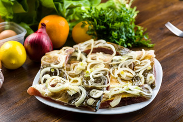 Carp marinated in onions