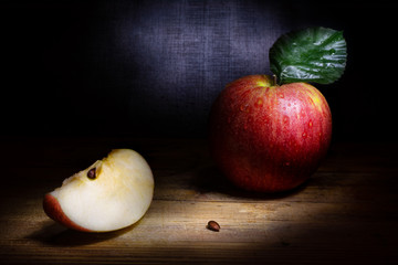 Fresh red apple on rustic background