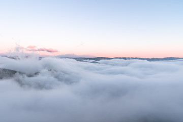 Fototapeta na wymiar Fog Waves above the Boulder Canyon, Boulder, CO, USA