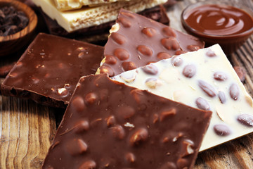 Chocolate bars on table with chocolate tower.