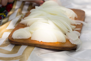 chopped onion on the board in nature