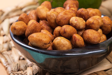 Peanuts coated full in the bowl in a bar