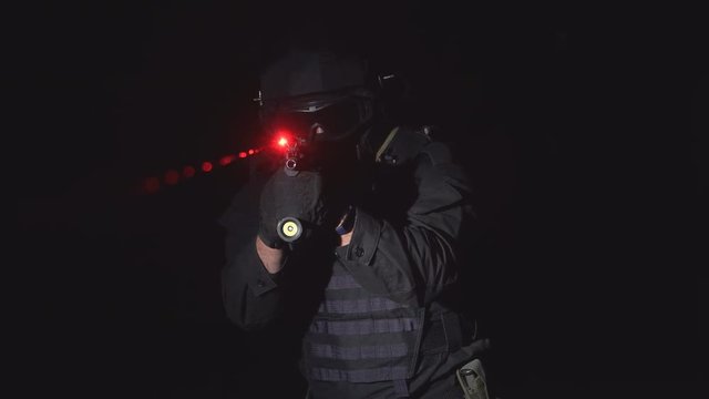 Soldier aiming assault rifle laser sight. 4k