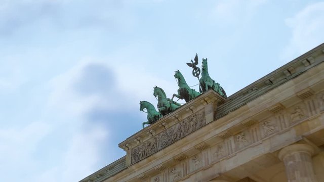 Quadriga of Brandenburg Gate (Brandenburger Tor) on Pariser Platz in Berlin, Germany. Time Lapse In Motion. Hyper Lapse. 4K