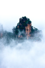 Early morning mist in the Tianzi Mountain Natural Reserve near Xiangyuan Inn, Helong Park. Wulingyuan, Zhangjiajie, Hunan, China.