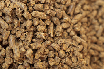 Fuel wood pellet close-up. A source of alternative clean energy. A lot of pellet. Natural fuel and energy of future.