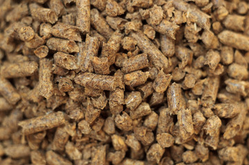 Fuel wood pellet close-up. A source of alternative clean energy. A lot of pellet. Natural fuel and energy of future.