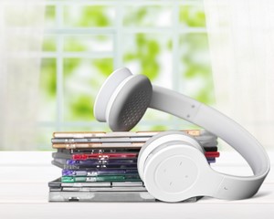 Headphones and compact discs  isolated   on background