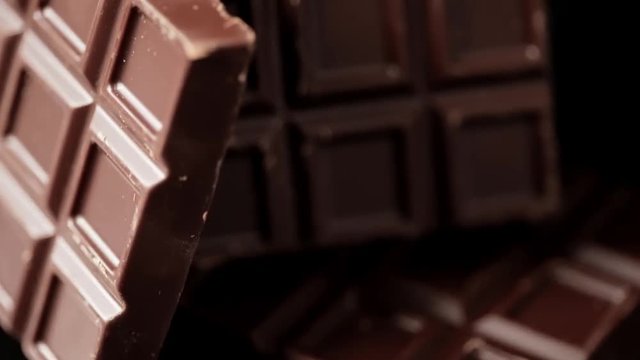 Cutting brownie with nuts. Brownie cuts falling. Slow motion. Montage