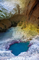 Mystic deep water hole in rocks  in Fontaine-de-vaucluse, source of river Sourge in low stand during summer months.