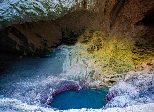 Mystic deep water hole in rocks  in Fontaine-de-vaucluse, source of river Sourge in low stand during summer months.