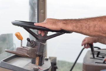 Farmer driving tractor in the countryside