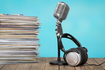 News and microphone on table.